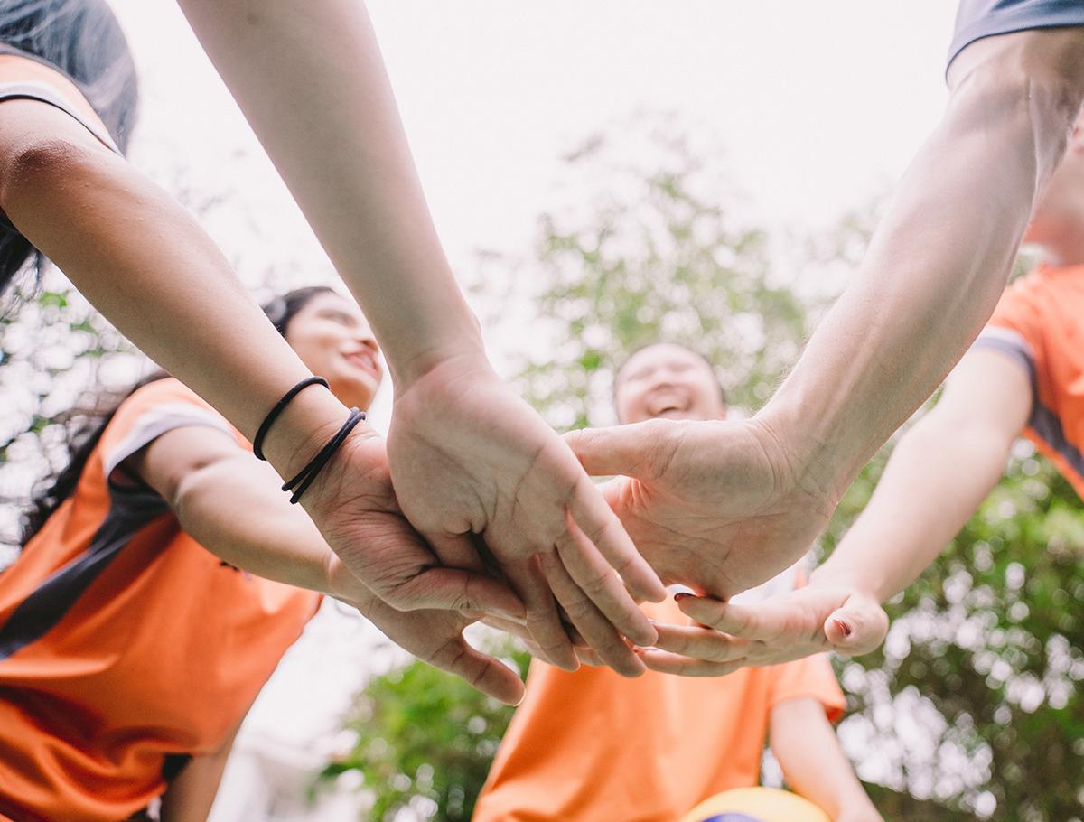 EIS Students Hands together EIS Students Hands together