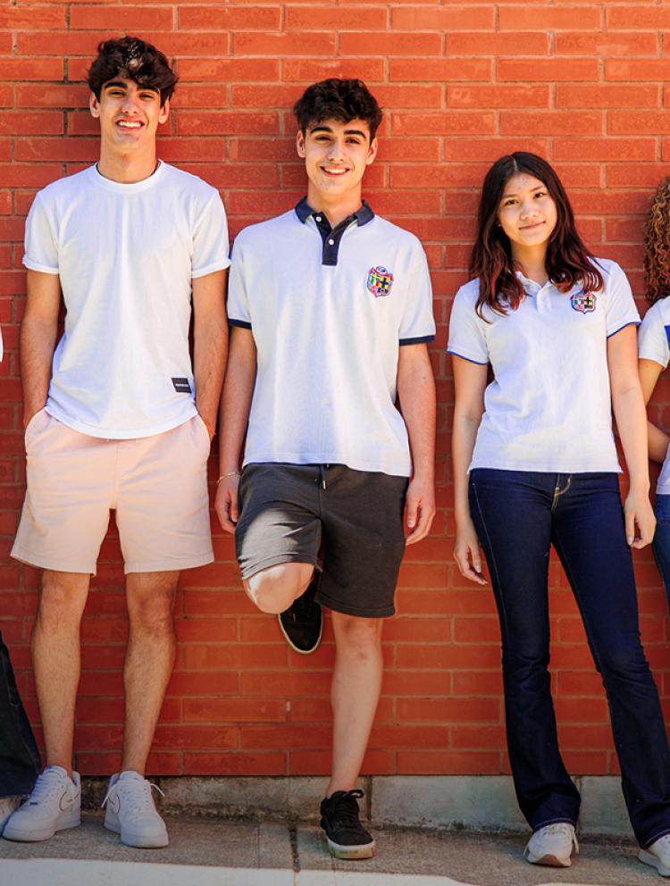 students-standing-together-waring-school-uniform