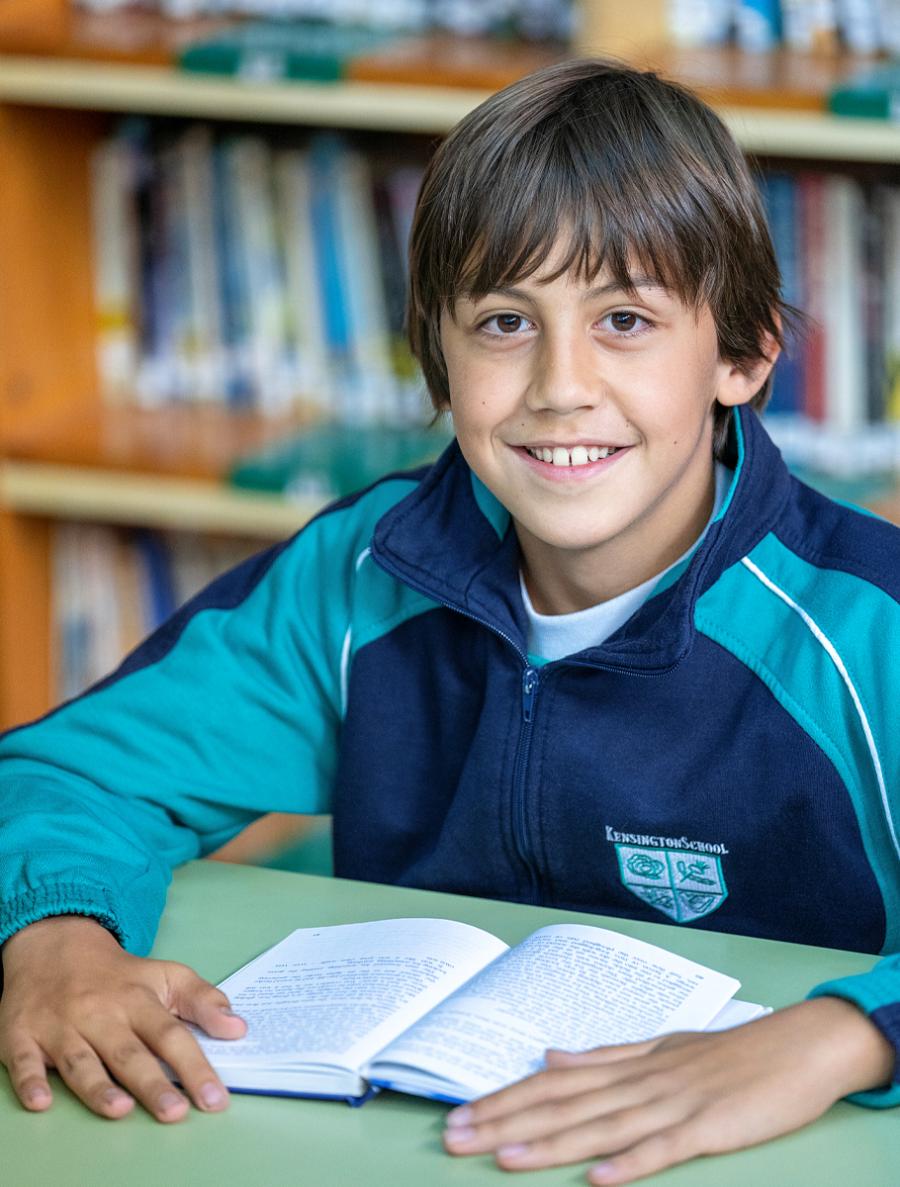 academics-boy-smiling-book academics-boy-smiling-book